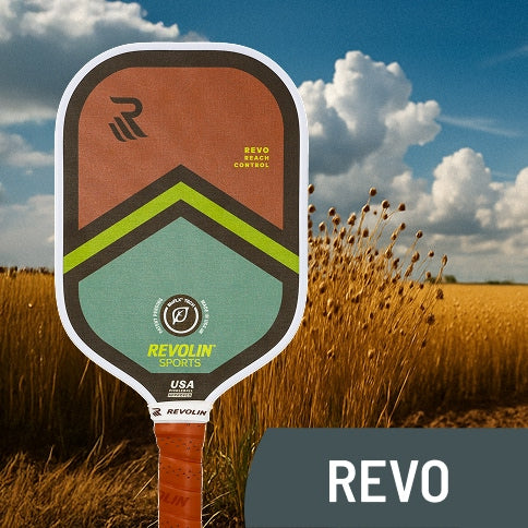 Revolin Revo series Pickleball paddle with 'Revolin Sports' branding against a flax field background