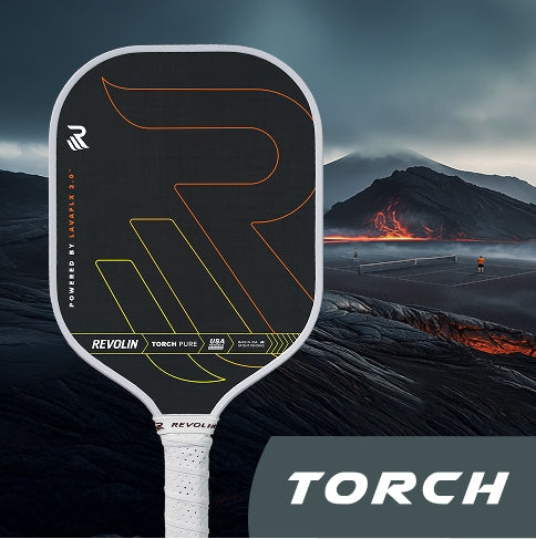 Pickleball paddle with 'TORCH' branding against a volcanic landscape background